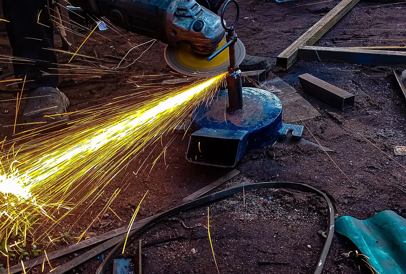 Grinder sparks during steel fabrication